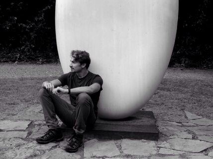 Gabriel Cramer sitting on the ground.