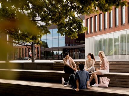 Students in front of Väre building of Aalto University campus