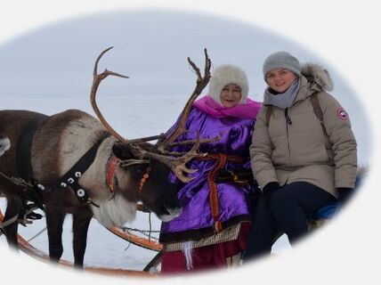 Photo of two women and reindeers in Nenets Region of Russian Arctic