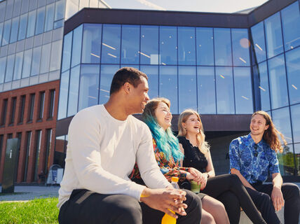 Aalto University students enjoying sunny weather