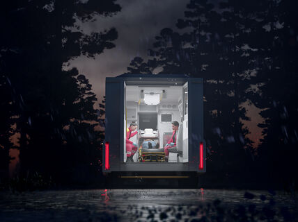 Paramedics treat a patient in an AMRI based Mobile Stroke Unit in a remote area at night