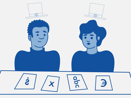 Two doctoral students looking at symbols on pieces of paper, with imaginary doctoral hats floating above their heads.