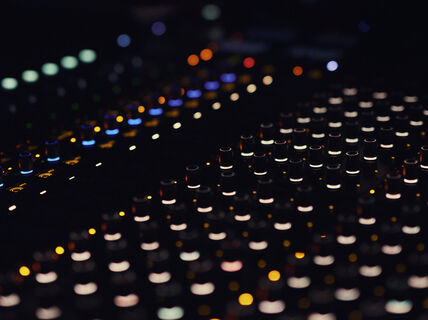 Mixing table with lights on.