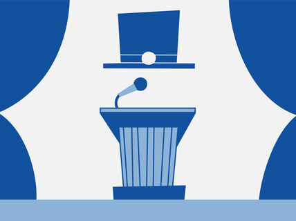 Doctoral hat floating above a speaker's podium with a microphone.