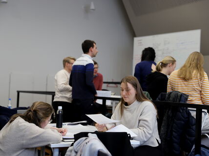 Students doing group work at Negotiations in Planning course.