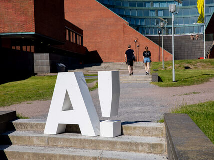 The Aalto logo on the steps going up to Undergraduate Center building