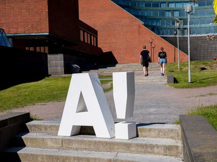 The Aalto logo on the steps going up to Undergraduate Center building