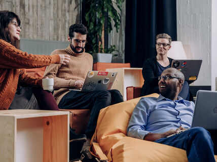 Aalto University employees having a meeting. Photo: Aalto University/Aleksi Poutanen