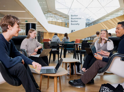Students sitting at Aalto University School of Business