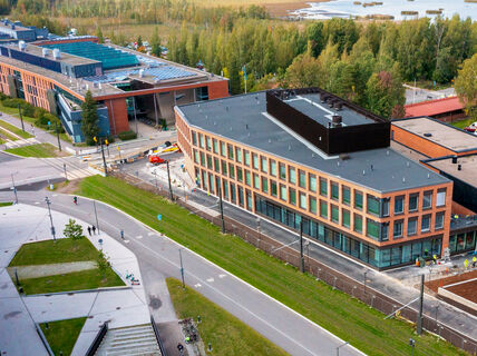 An aerial image from early autumn of a new building soon to be finished on campus.