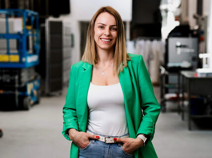 Professor Dessbesell in a lab, wearing a green jacket
