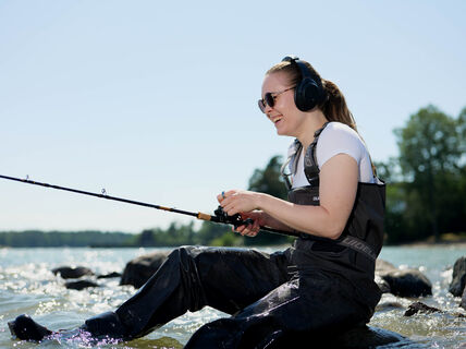 women fishing and listening a lecture