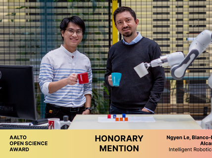 Two of the awardees and their robotic arm all holding colorful mugs. Aalto Open Science Award, Honorary mention.