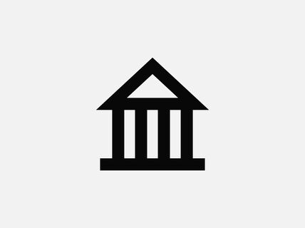 Ikonimainen kuva klassisesta pylvästä sisältävästä rakennuksesta, mustalla valkoisella taustalla.