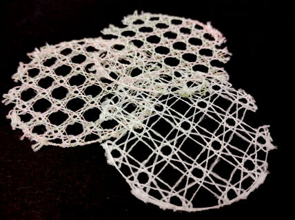 Image shows circular samples of yarns laced into textile structures