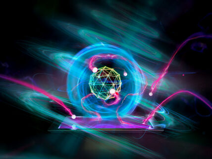 Glowing neon sphere with geometric core and light trails floating above a tablet in the dark