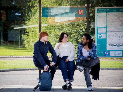 Aalto University students at the Aalto University tram stop on campus. Photo: Matti Ahlgren.