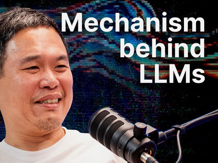 Smiling man at black microphone, text reads “Mechanism behind LLMs” on colourful digital background