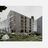 Thumbnail of Modern multi-storey apartment building with large balconies, surrounded by greenery and rocks.