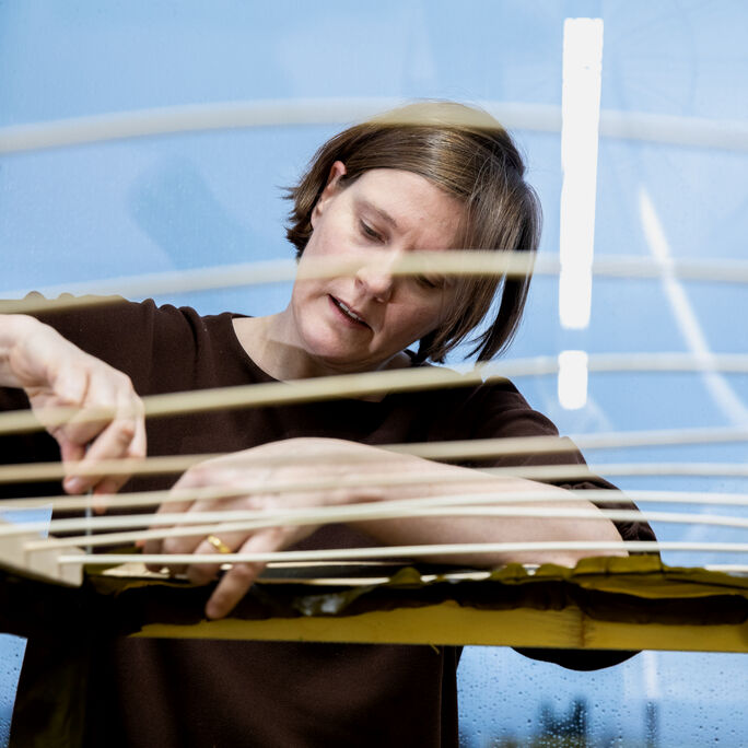 Julia Lohmann working on her installation called Hidaka Ohmu. Photo: Mikko Raskinen