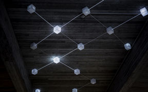 Otaniemi campus art: light cubes on the ceiling connected by a wire. Photo by Aalto University / Julia Weckman