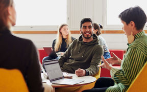 Students of Aalto University School of Science doing a group work on their computers