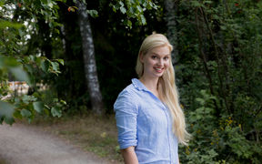 Silja Sormunen standing on a forest path in Otaniemi