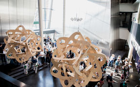 Computer Science building lobby filled with students at Aalto University campus