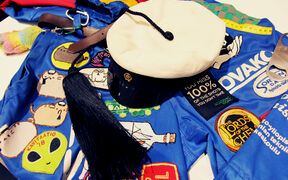 A blue overall with Teekkari cap