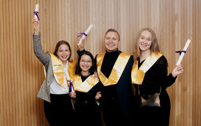 The picture shows Georg Namuth and three other CEMS graduates celebrating at the graduation ceremony. 