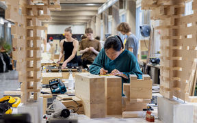 Student working on a project in a wood workshop. Photo: Mikko Raskinen / Aalto University