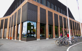Marsio building seen from the outside, Marsio text and Aalto logo in the window