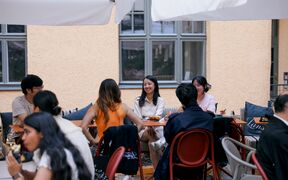Students networking at a social event by Aalto University Summer School in Helsinki.