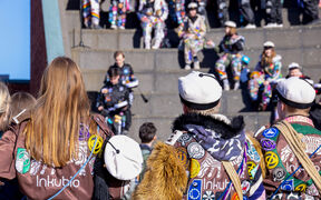 Students wearing overalls and student caps