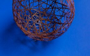 willow fibre ball on a blue surface