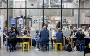 Alumni discussing across multiple tables