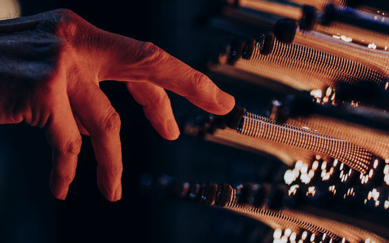 A hand using the quantum garden installation
