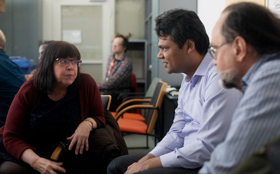 Professor Merja Penttilä (left) and Assistant Professor Vikas Garg having a conversation in a meeting room.