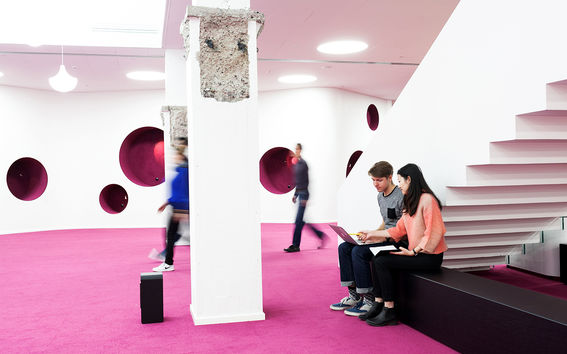 Students walking and working in the basement floor of the Harald Herlin Learning center / photo by Aalto University, Aino Huovio
