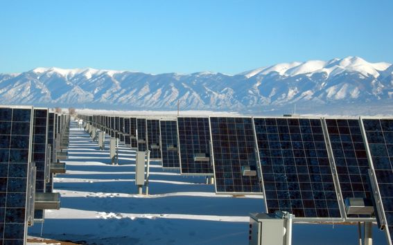 Solar panels in front of mountains