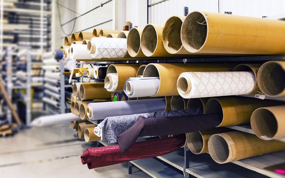 Rolls of fabric in warehouse