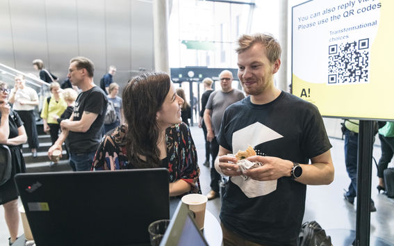 Two persons discussing in Aalto University community event on new strategy