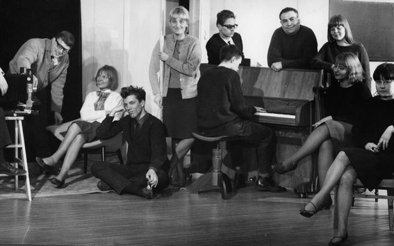 men and women posing in black and white photo