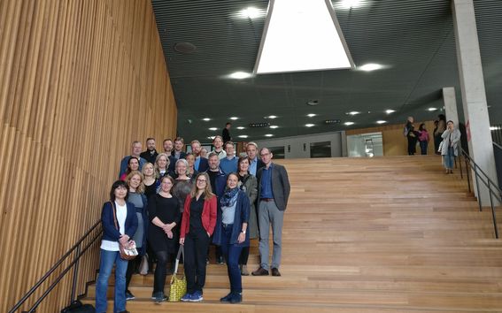 23 visitors from University of Copenhagen standing in the stairs of Väre building.