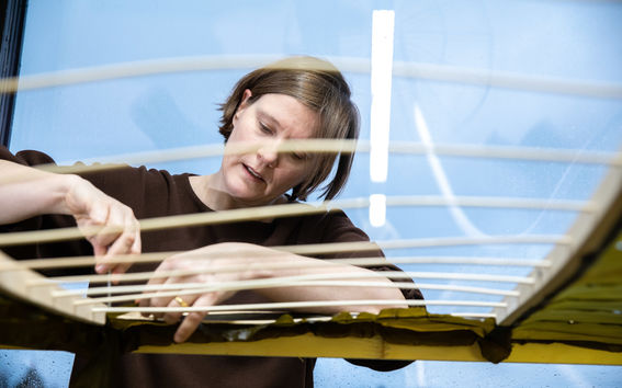 Julia Lohmann working on her installation called Hidaka Ohmu. Photo: Mikko Raskinen