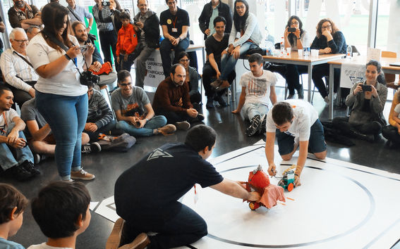 Hebocon event, people performing and watching the performance