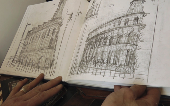 a sketchbook with some sketches of buildings