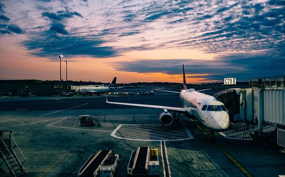 Airplane at gate in evening