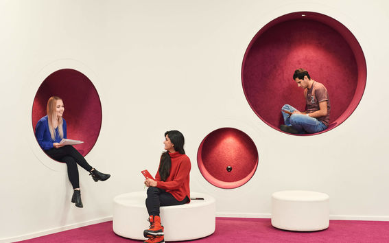 Students sitting and talking in the library