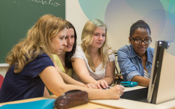 Unite! intercultural students working in a group around a laptop